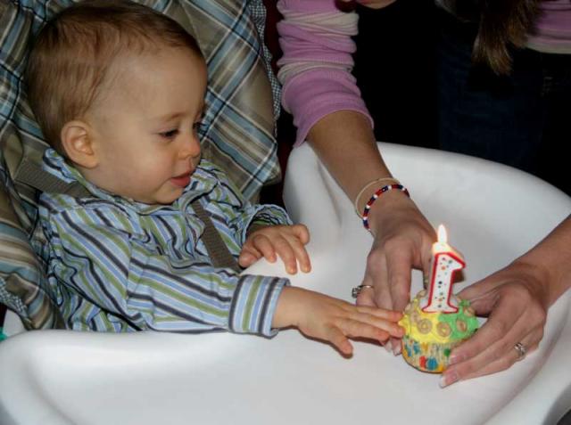 Ohhh, a cupcake! And a candle! And such a pretty song everyone's singing!