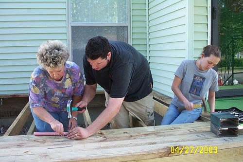 Jake, Janet, and Abby - nailing down boards - no nail gun for us!