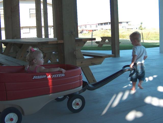 Logan giving Miss Emmy a ride in the wagon!
