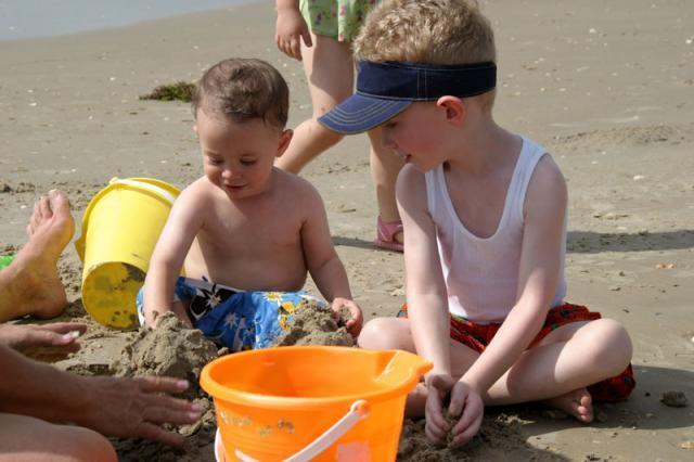 Helping Logan with his sand castle