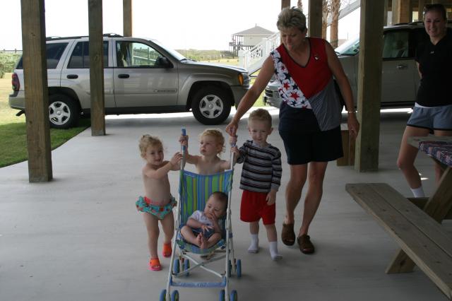 Gammy's trying to keep the stroller under control.