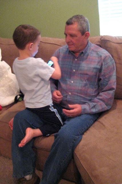 Showing Papa how to play games on the iPod ~ April 15, 2009