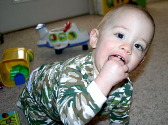Mmmm, food off the floor is the best! (Pretty sure it was a Cheerio) ~ January 26, 2007
