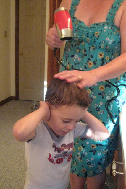 Getting his hair blow-dried ~ June 6, 2009