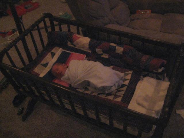 Sleeping in Daddy's old bassinet ~ March 1, 2009