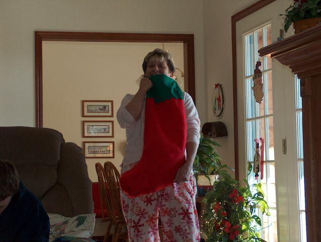...and lugging in Jake's massive stocking!