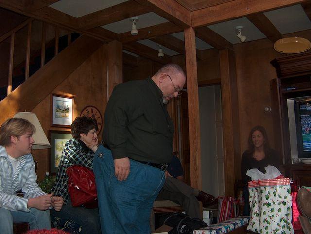Mike deciding which present to open