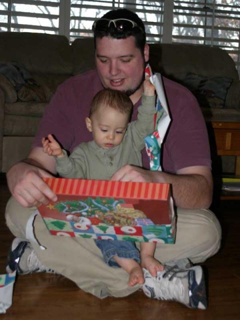 Tyler's a pro at opening presents