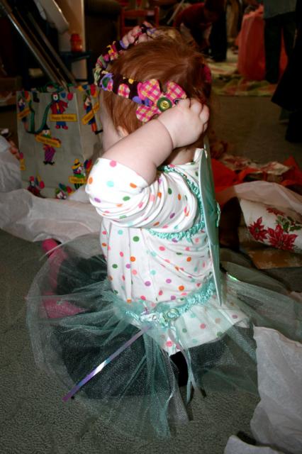 Trying on the cute flower headband made by Aunt Janet
