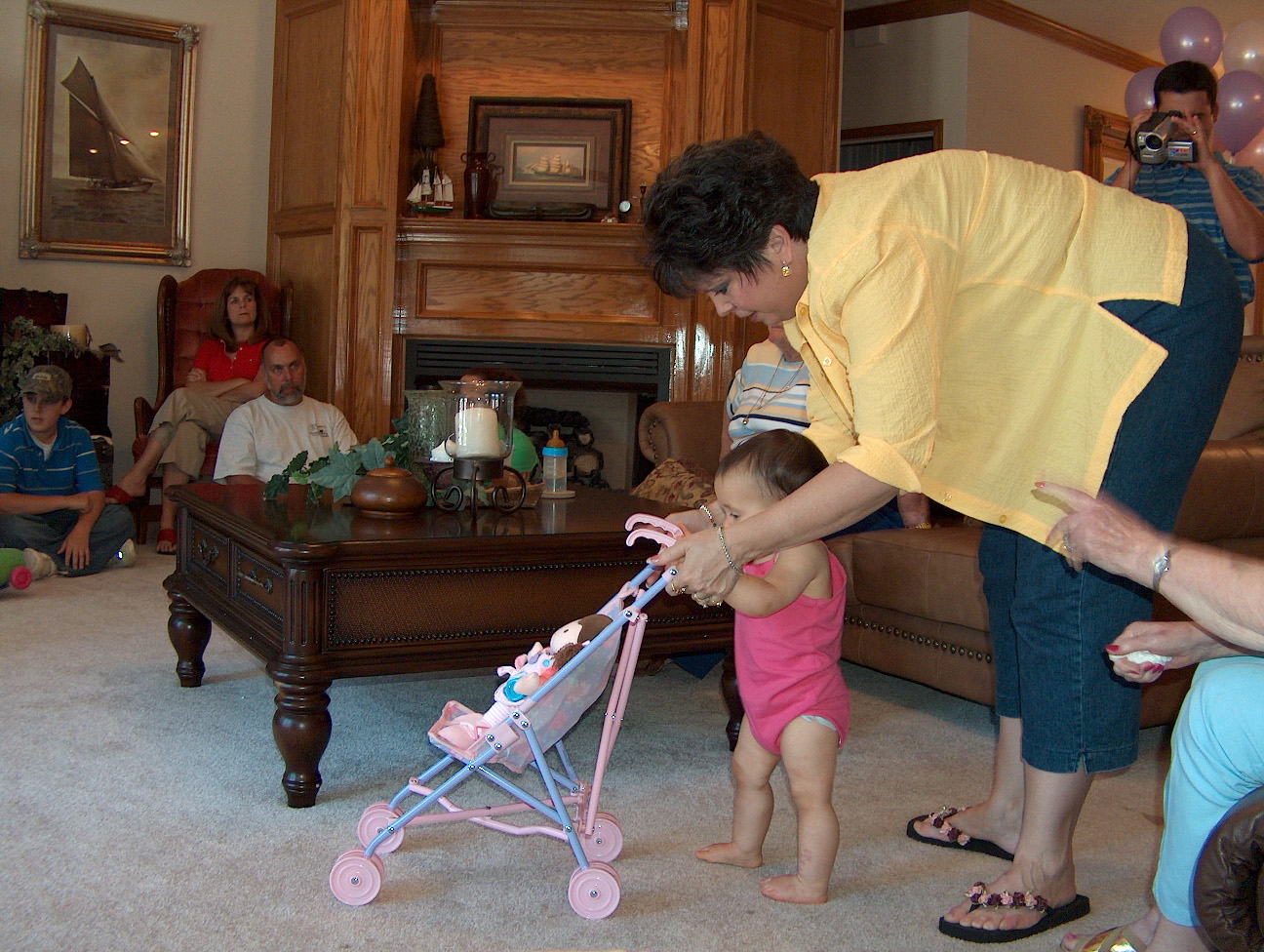 Nana helping Gracie get the stroller straight
