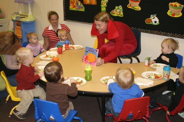 Miss Tiffany reads them a Clifford book, so they'll get her costume