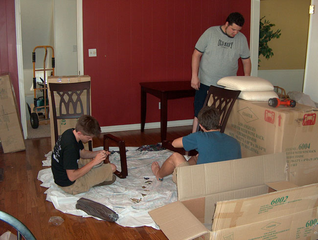 Luckily, John and Brandon stuck around to help put together the dining room table and chairs!