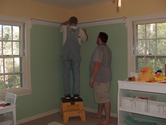 Jake's really just there to catch Joe if he falls off the step stool!