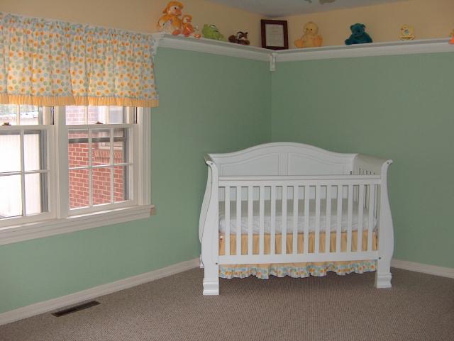 The crib corner, dust ruffle also made by "Gammy"