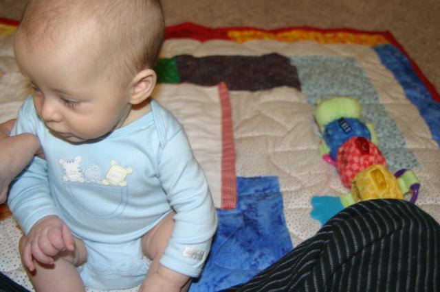 Practicing sitting up with Mama's help