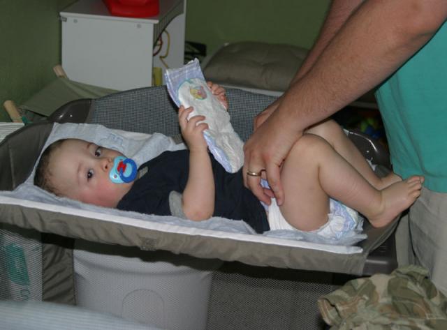Diaper time again! (Mama's figured out that if she has the camera, she doesn't have to change diapers.)
