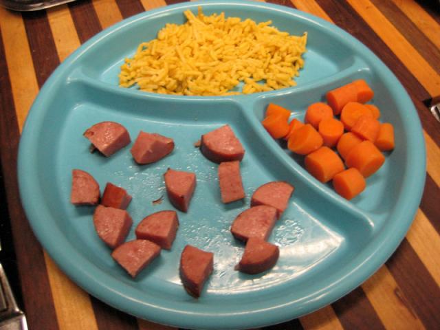 Tyler's lunch - leftover polish sausage, rice and carrots