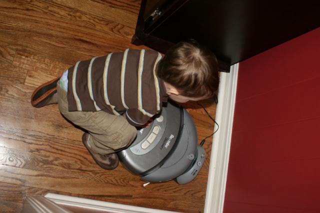 He's obsessed with the Roomba (but terrified of it if it's ever turned on)