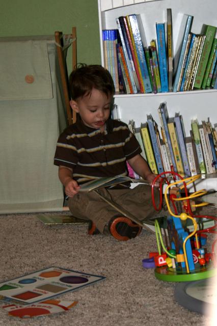 Jabbering away, reading to himself