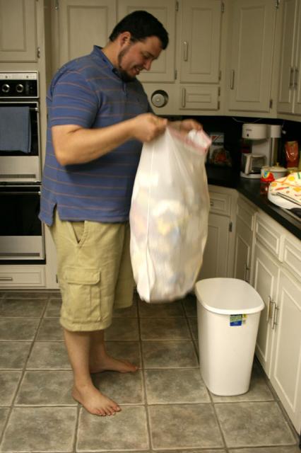 Jake being helpful (after the trash can sat out obviously full all day long)