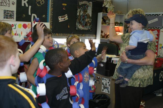 Trying to get Tyler to say bye. He wasn't participating, but he thought everyone else was pretty funny.