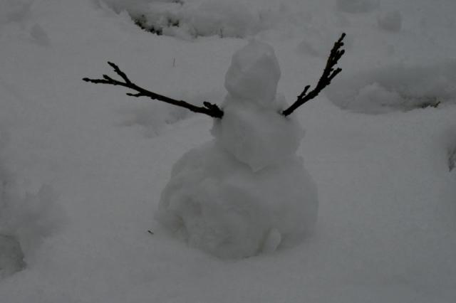About 8 inches tall, but at least he has arms!