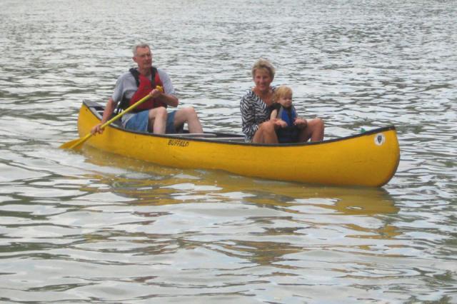 Jimmy, Di and Jackson going for a canoe ride
